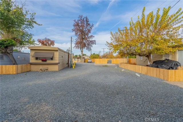 a view of a house with swimming pool and sitting area