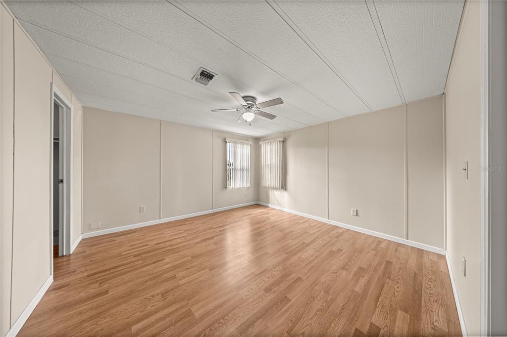 712 Devon Drive Lady Lake, FL 32159 - Photo 15 of 31 a view of an empty room with a window