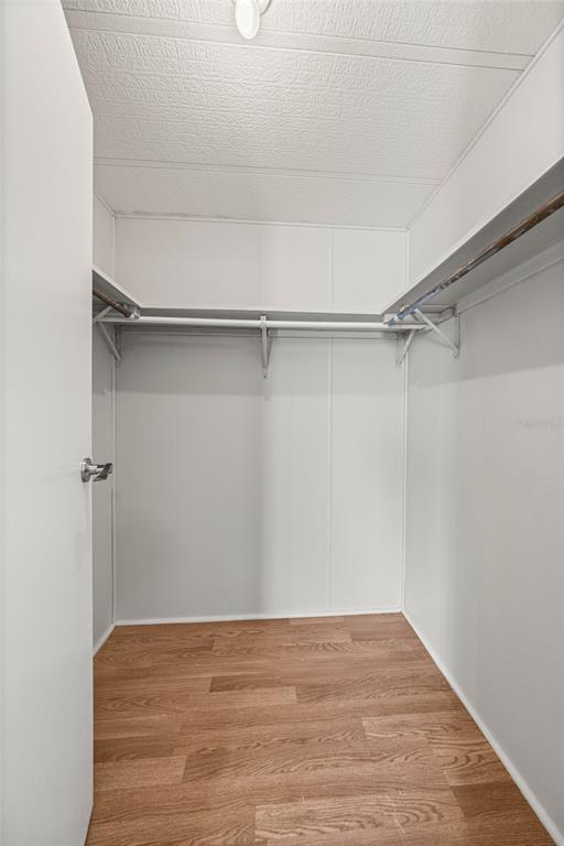 712 Devon Drive Lady Lake, FL 32159 - Photo 17 of 31 a view of an empty walk in closet