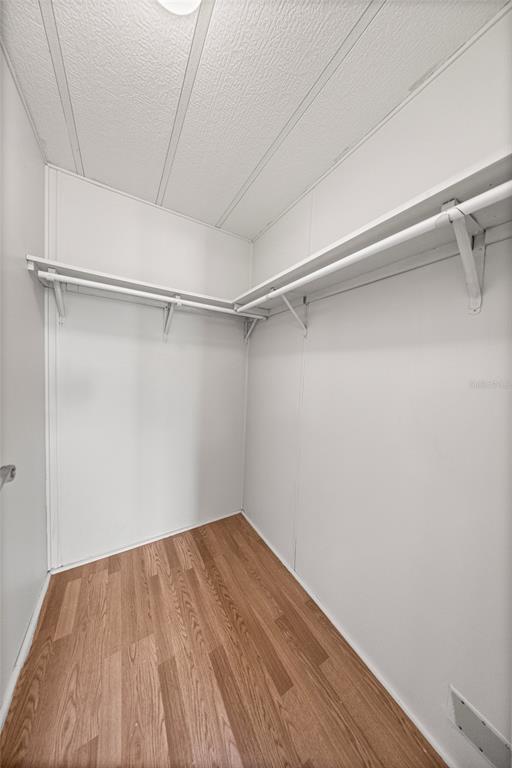 712 Devon Drive Lady Lake, FL 32159 - Photo 19 of 31 a view of a room with wooden floor