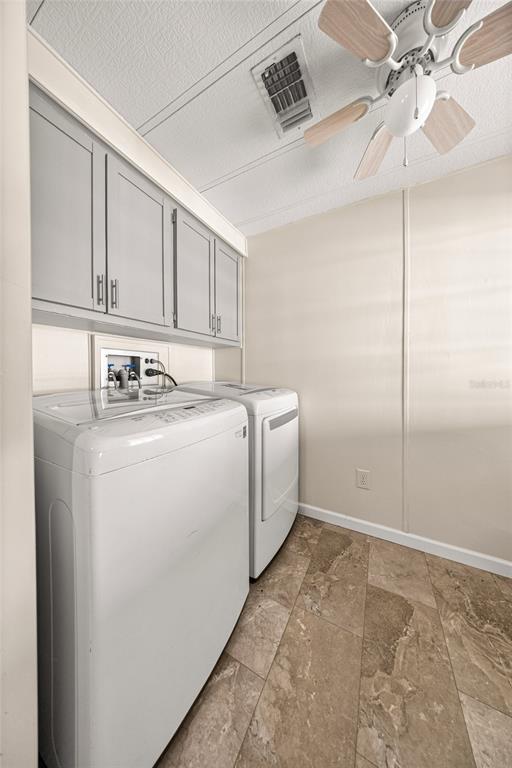 712 Devon Drive Lady Lake, FL 32159 - Photo 22 of 31 a utility room with closet dryer and washer