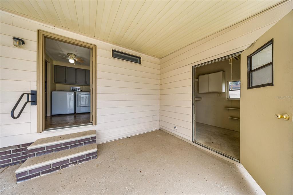 712 Devon Drive Lady Lake, FL 32159 - Photo 23 of 31 a view of a room with rack on the wall