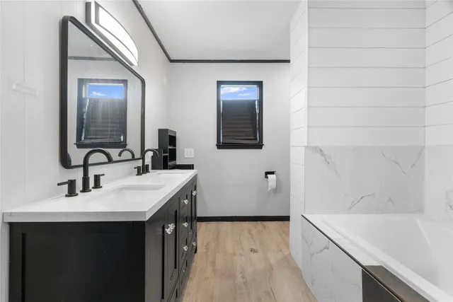 a bathroom with a sink and a bathtub