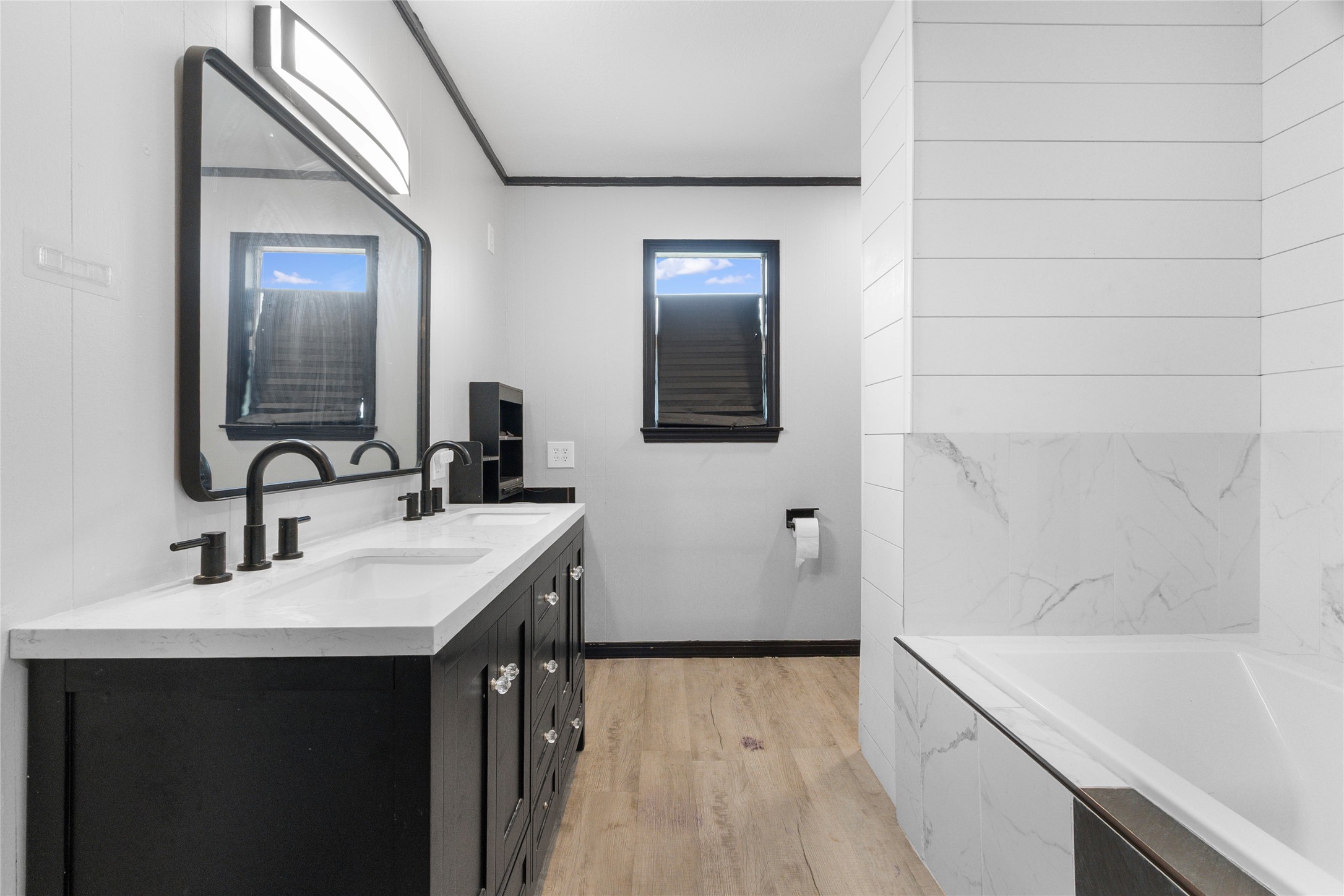 10315 North Walker Road Cleveland, TX 77328 - Photo 14 of 27 a bathroom with a sink and a bathtub