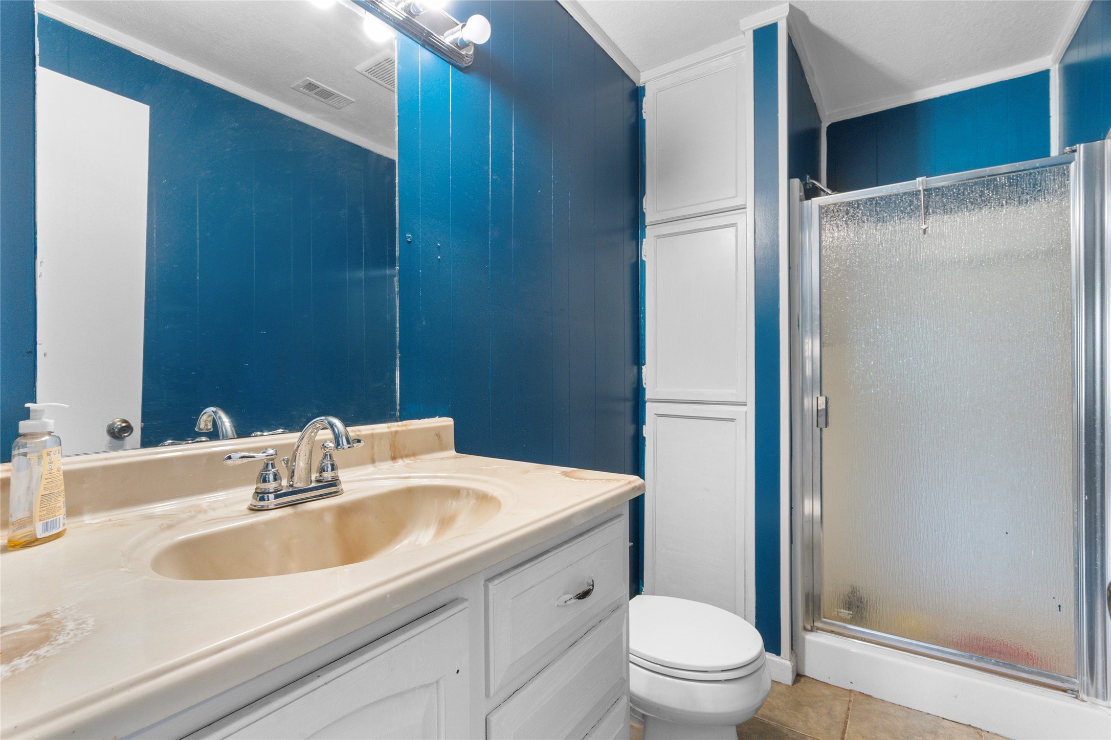 10315 North Walker Road Cleveland, TX 77328 - Photo 18 of 27 a bathroom with a sink toilet and shower