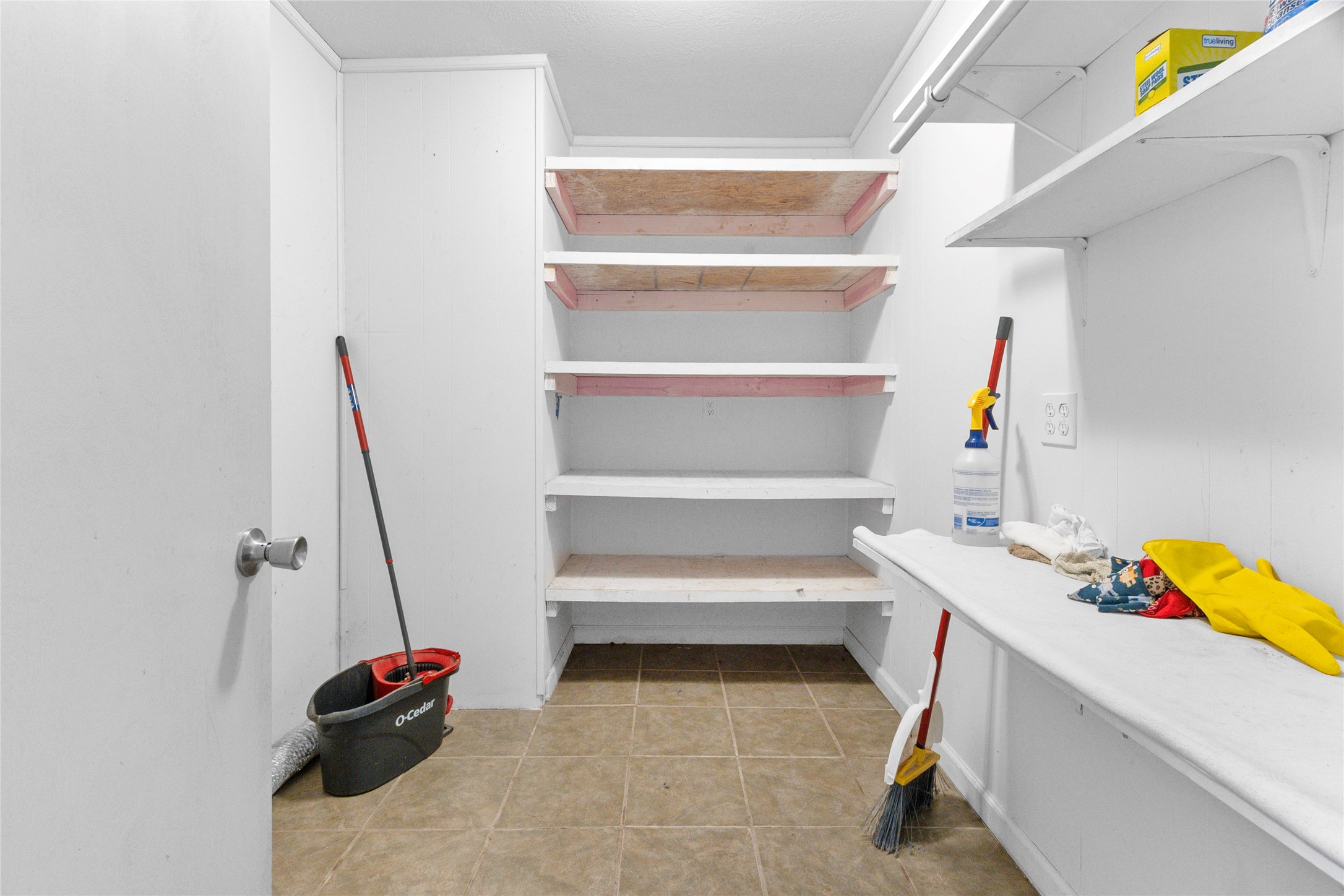 10315 North Walker Road Cleveland, TX 77328 - Photo 21 of 27 a view of walk in closet with clothes and shoes