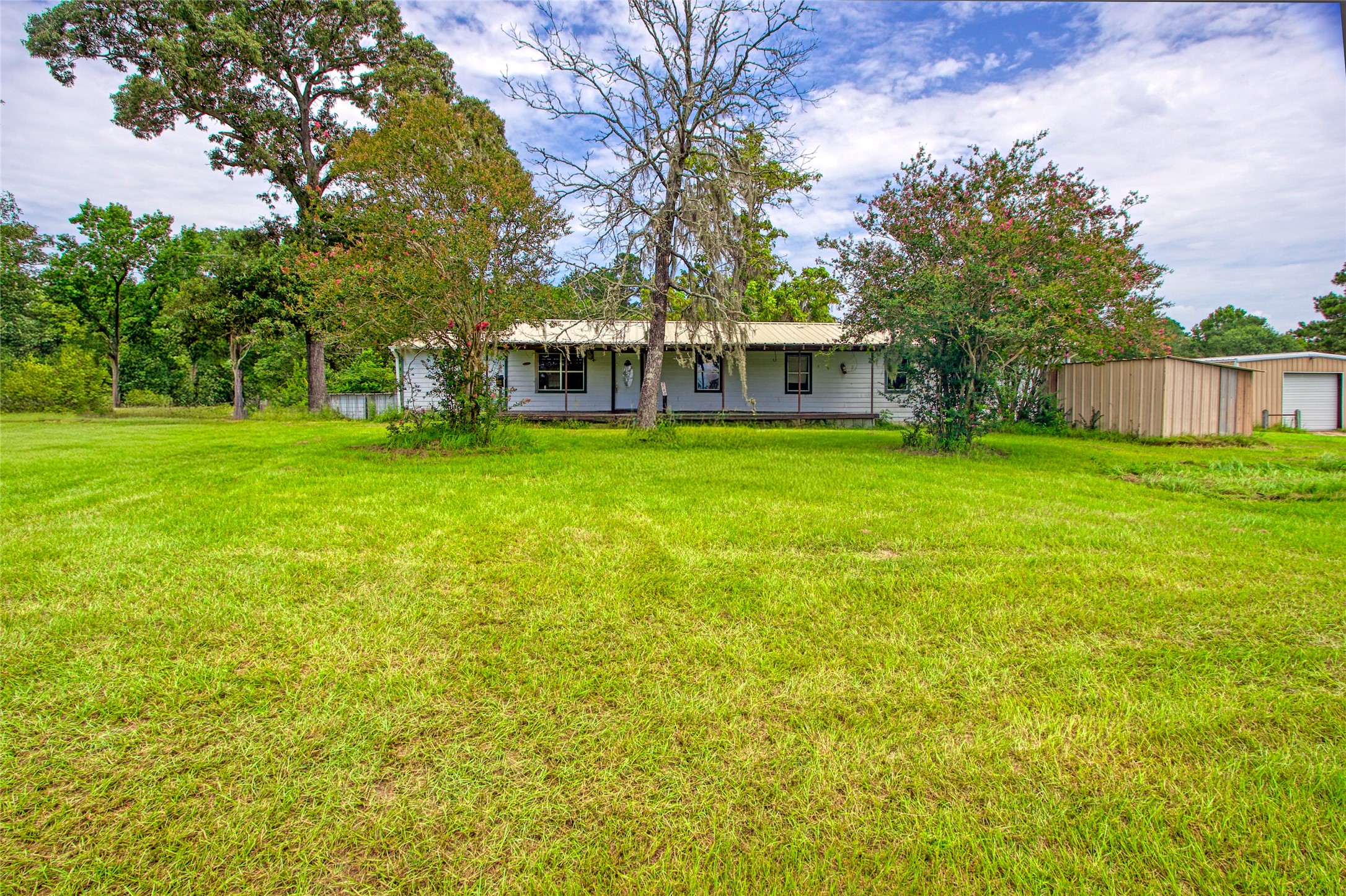 10315 North Walker Road Cleveland, TX 77328 - Photo 24 of 27 a view of a house with a big yard
