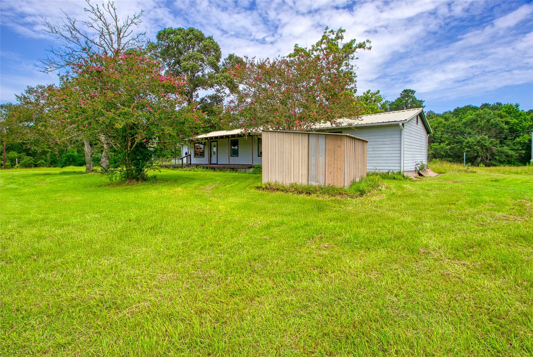 10315 North Walker Road Cleveland, TX 77328 - Photo 25 of 27 a front view of house with yard and trees