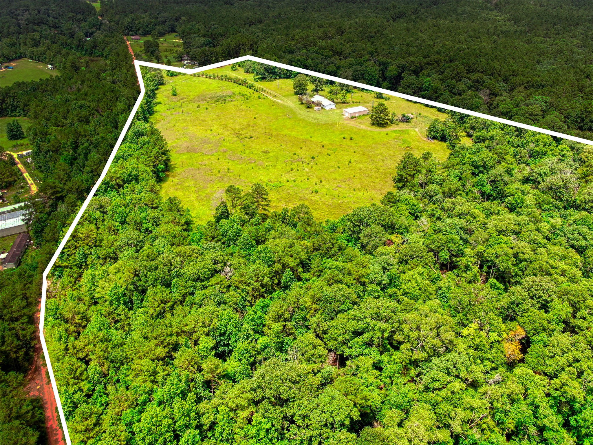 10315 North Walker Road Cleveland, TX 77328 - Photo 3 of 27 a large body of water with a green space