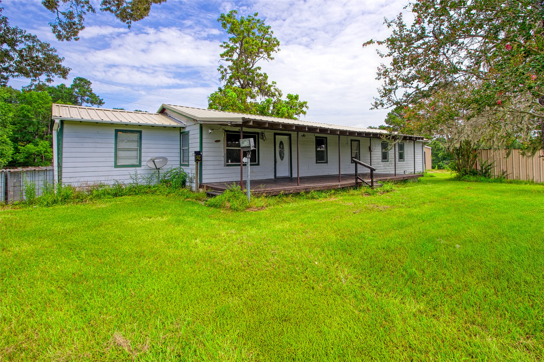 10315 North Walker Road Cleveland, TX 77328 - Photo 4 of 27 front view of a house with a yard