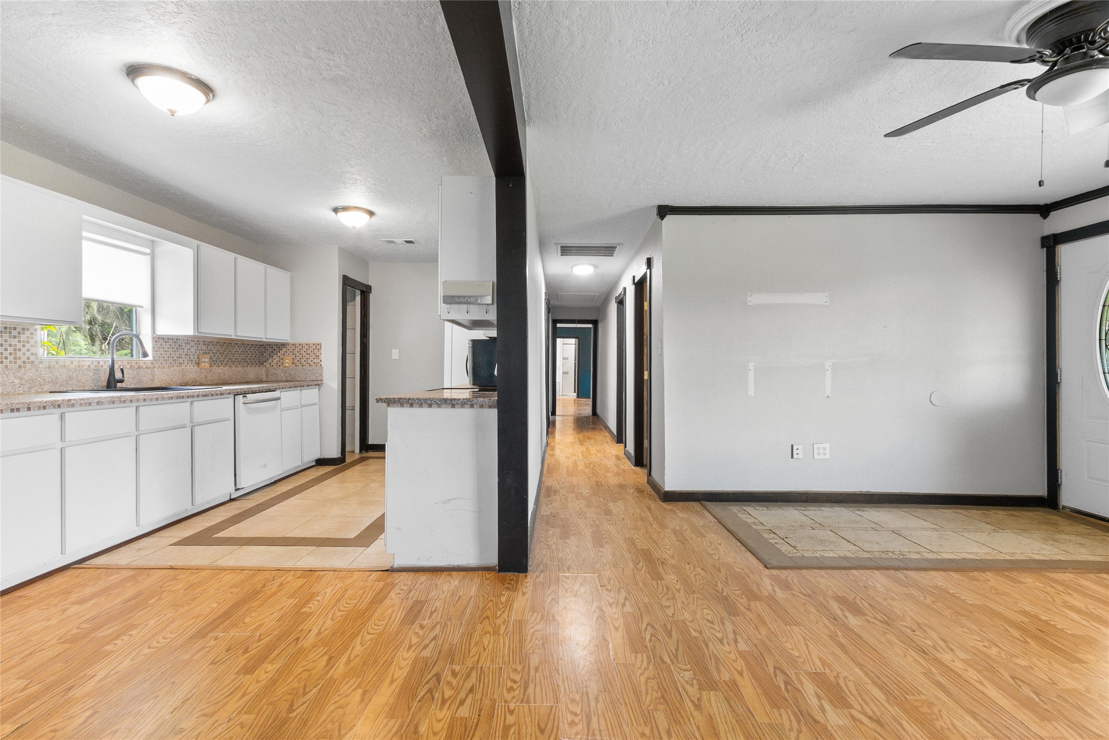 10315 North Walker Road Cleveland, TX 77328 - Photo 8 of 27 a view of a kitchen with a sink and a refrigerator