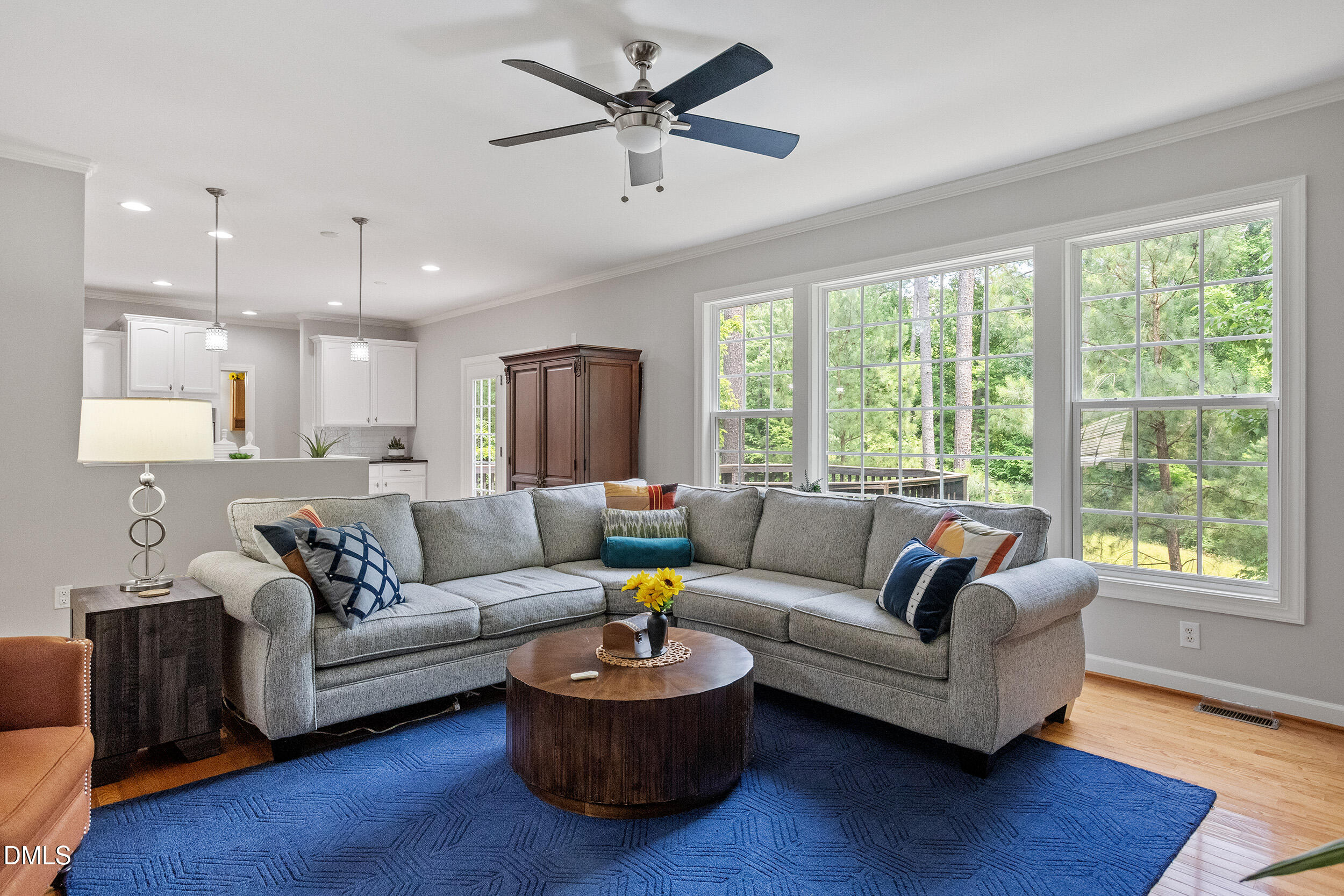 1019 Bianco Drive Raleigh, NC 27607 - Photo 8 of 29 a living room with furniture and a large window