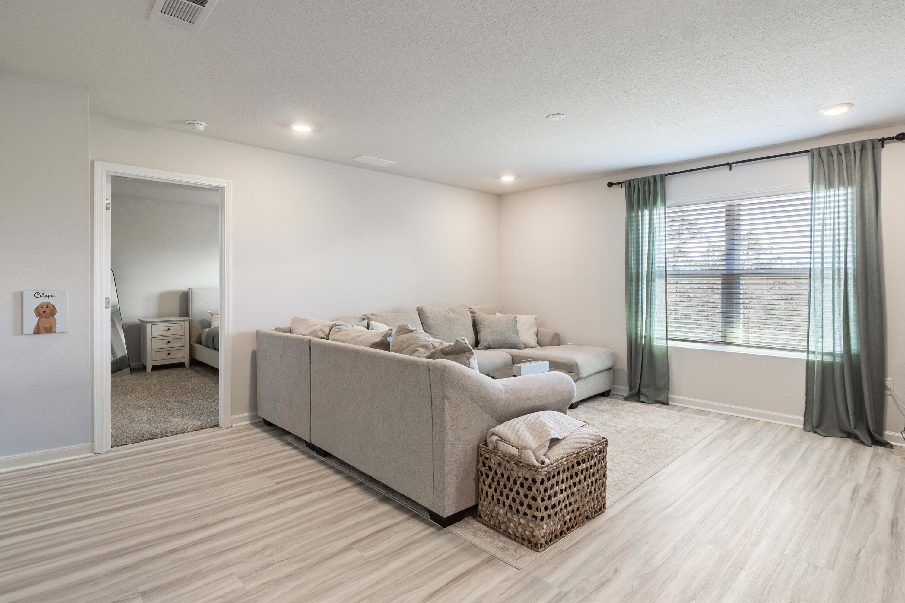 848 Otto Loop Crestview, FL 32539 - Photo 12 of 26 a living room with furniture and a wooden floor