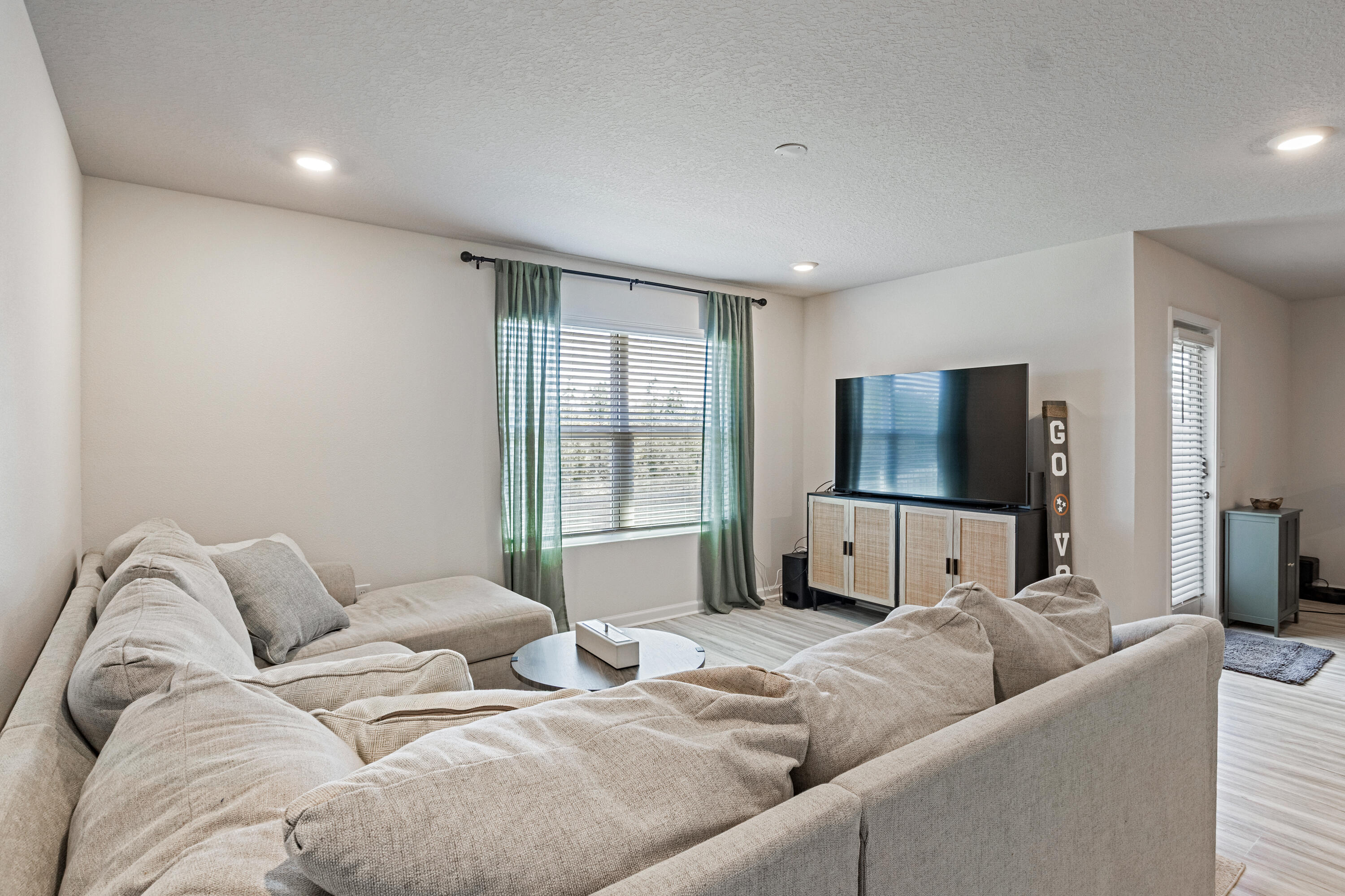 848 Otto Loop Crestview, FL 32539 - Photo 13 of 26 a living room with furniture and a flat screen tv