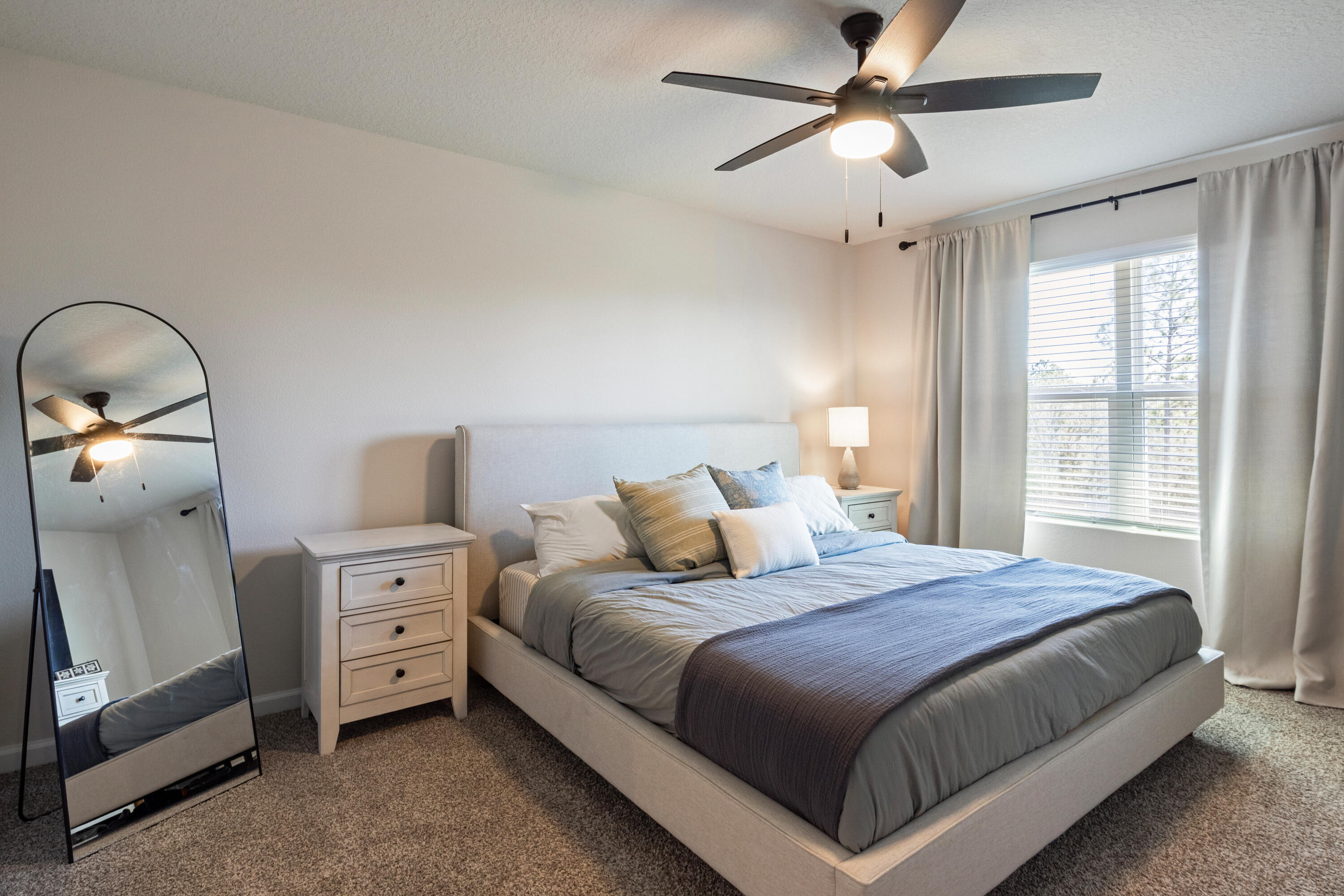 848 Otto Loop Crestview, FL 32539 - Photo 14 of 26 a bedroom with a bed and a chandelier