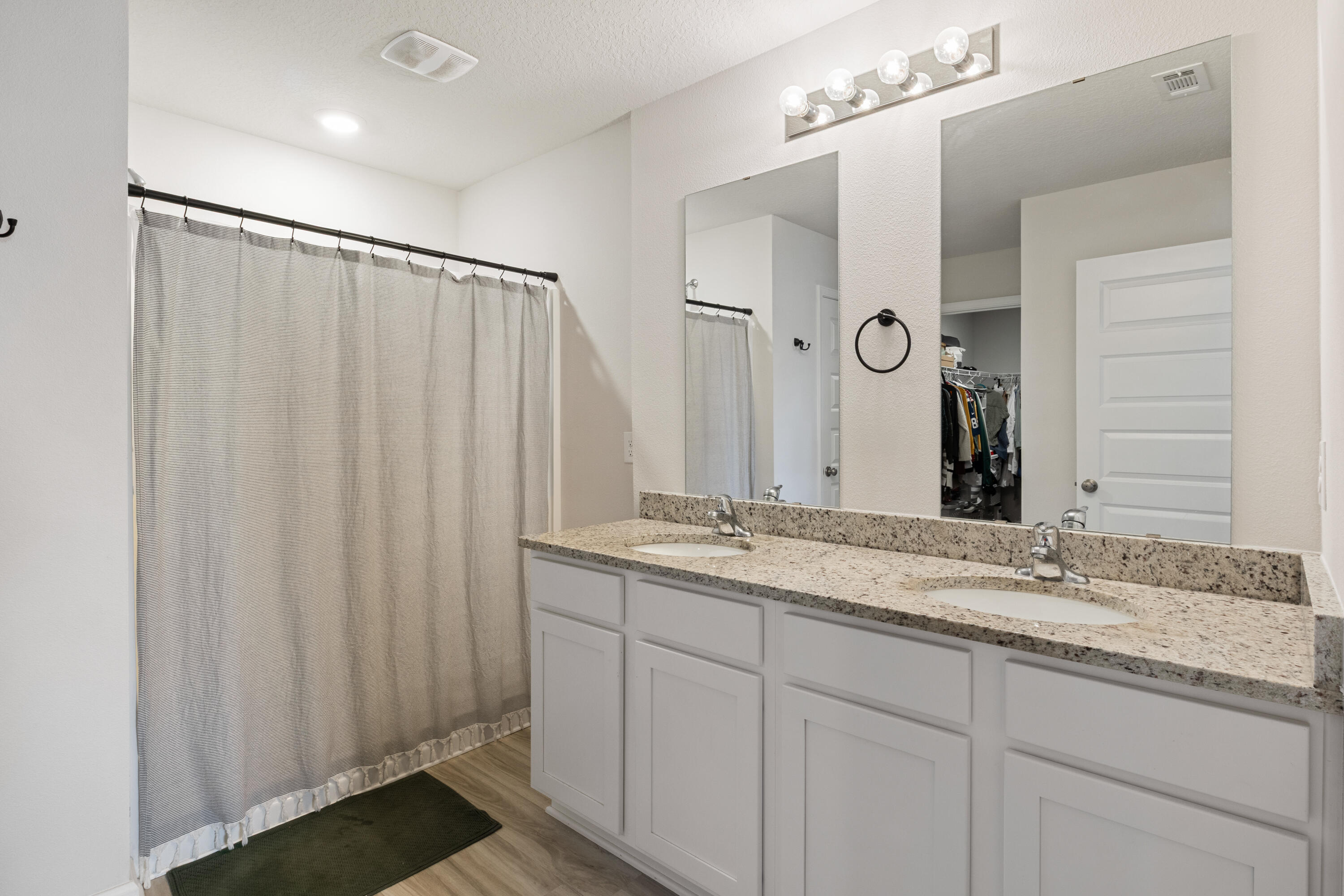 848 Otto Loop Crestview, FL 32539 - Photo 16 of 26 a bathroom with a granite countertop sink and a mirror