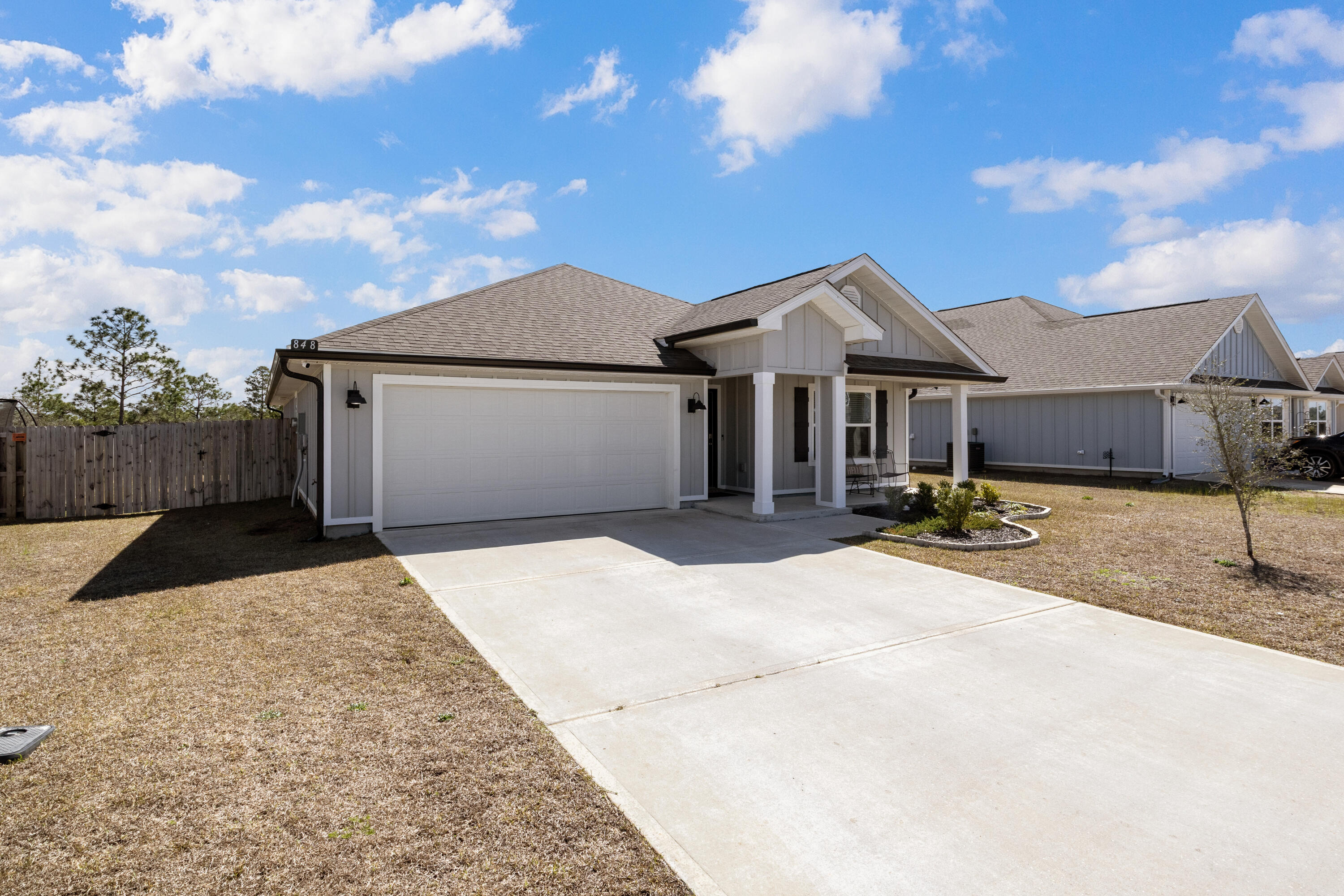 848 Otto Loop Crestview, FL 32539 - Photo 2 of 26 a front view of a house with a yard
