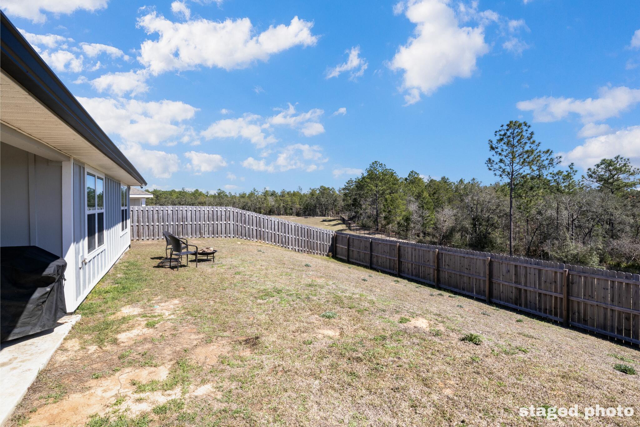 848 Otto Loop Crestview, FL 32539 - Photo 25 of 26 a view of small yard with wooden fence