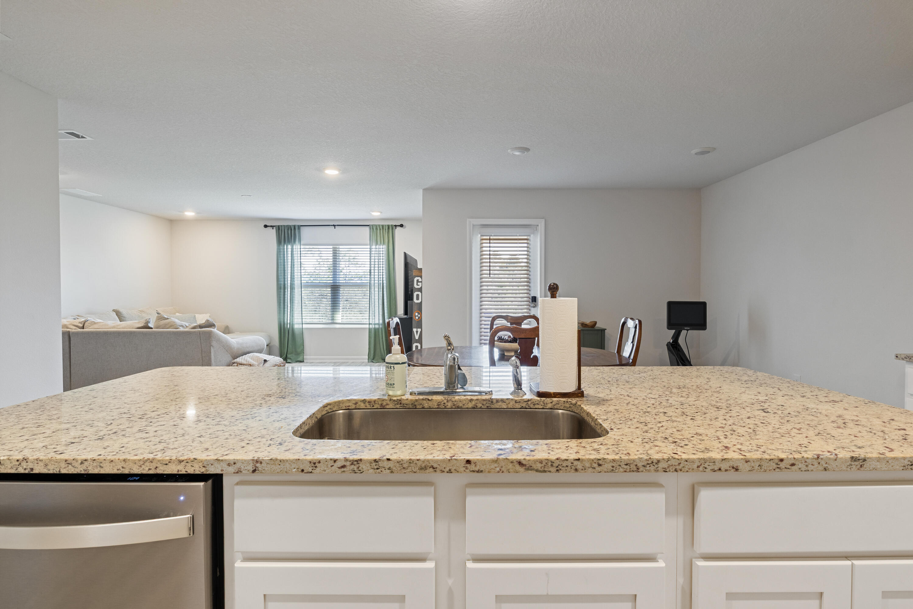 848 Otto Loop Crestview, FL 32539 - Photo 9 of 26 a kitchen with granite countertop a sink and natural light