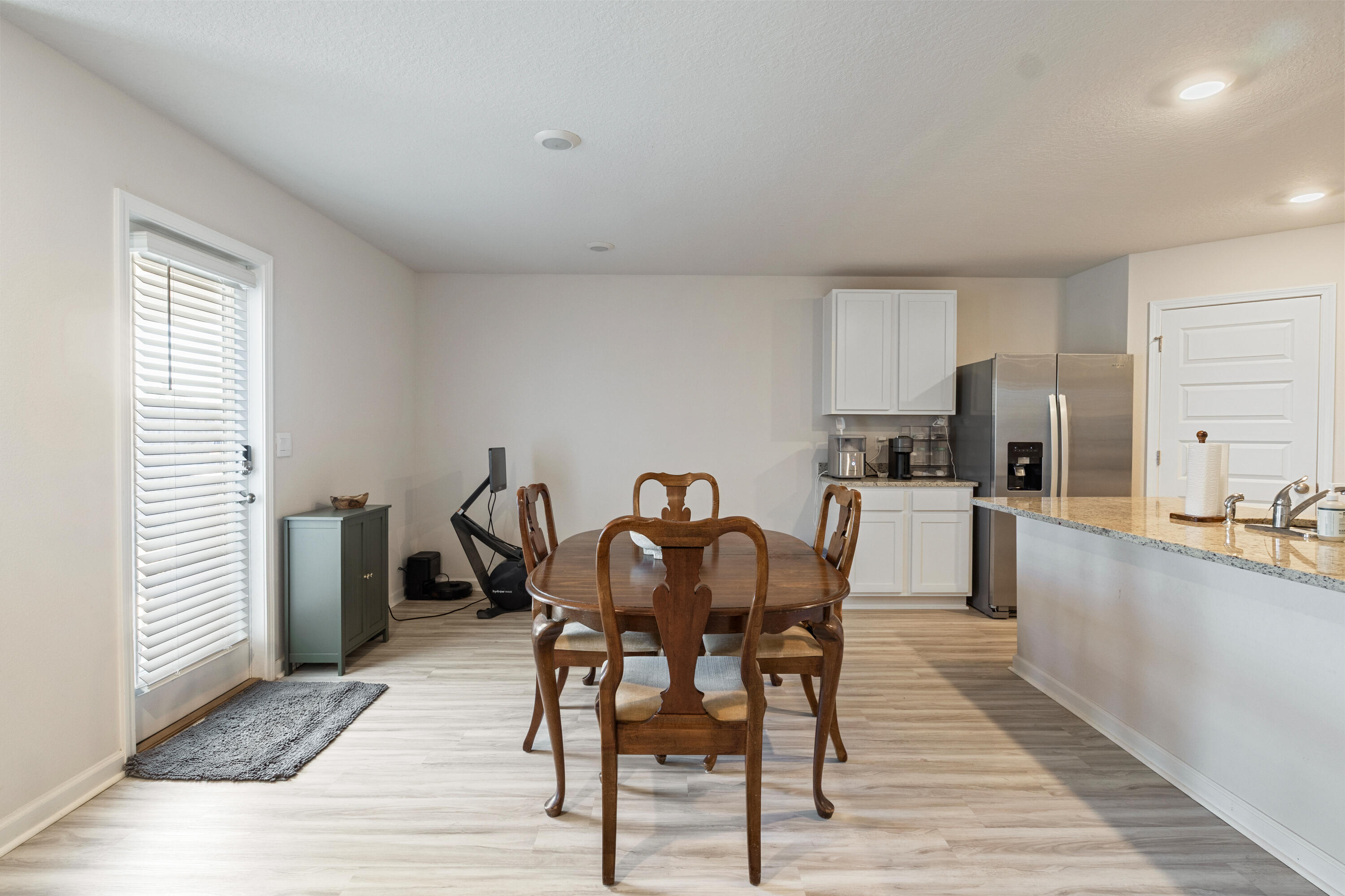 848 Otto Loop Crestview, FL 32539 - Photo 10 of 26 a view of a dining room with furniture and wooden floor