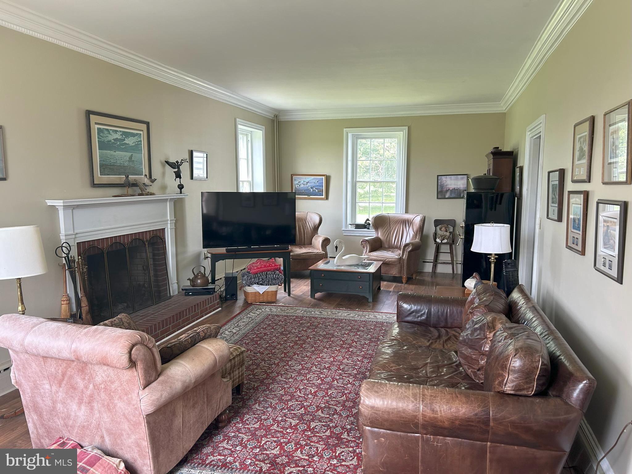 842 Salem Quinton Road Quinton, NJ 08079 - Photo 19 of 21 a living room with furniture a flat screen tv and a fireplace