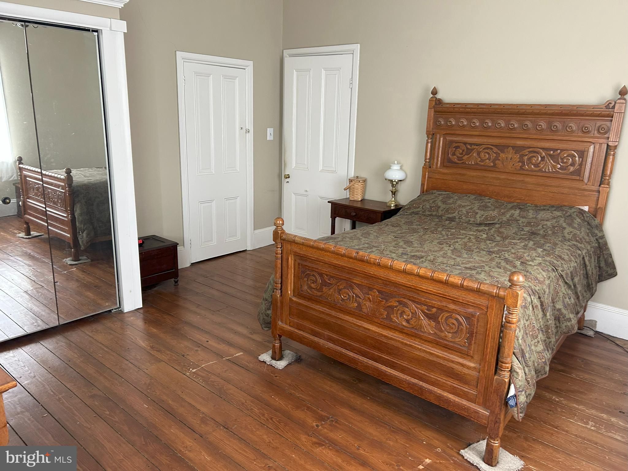 842 Salem Quinton Road Quinton, NJ 08079 - Photo 7 of 21 a bedroom with a bed and wooden floor