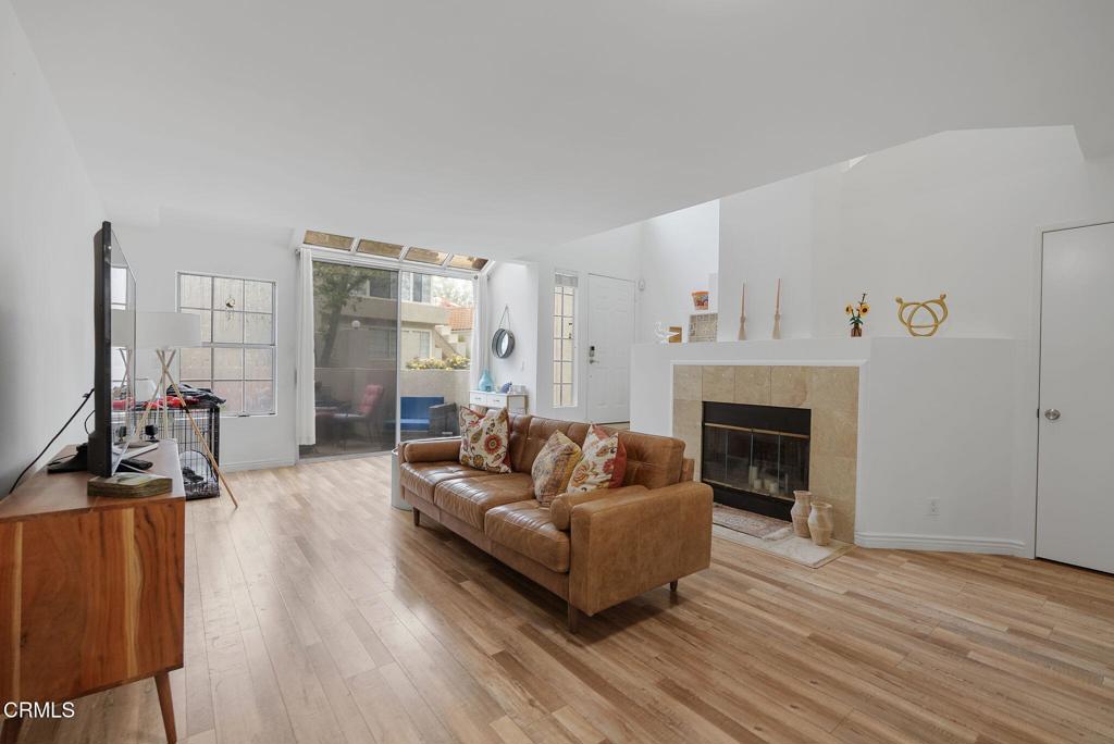 4240 Lost Hills Road, Unit 1702 Agoura Hills, CA 91301 - Photo 6 of 21 a living room with furniture and a fireplace