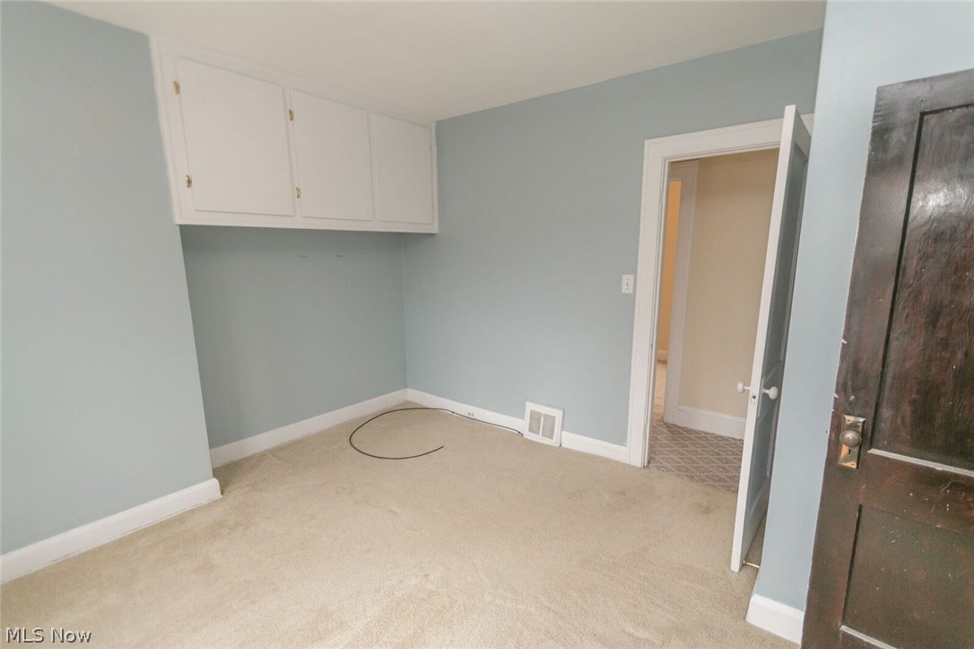 12909 Littleton Road Garfield Heights, OH 44125 - Photo 20 of 24 Additional cabinet built-ins frees up floor space for additional furniture placement.