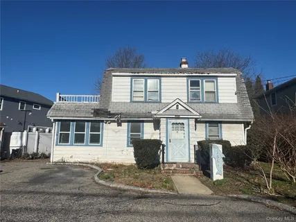 a front view of a house with yard