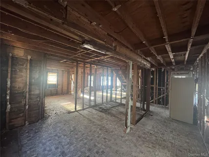 a view of an empty room with wooden frame