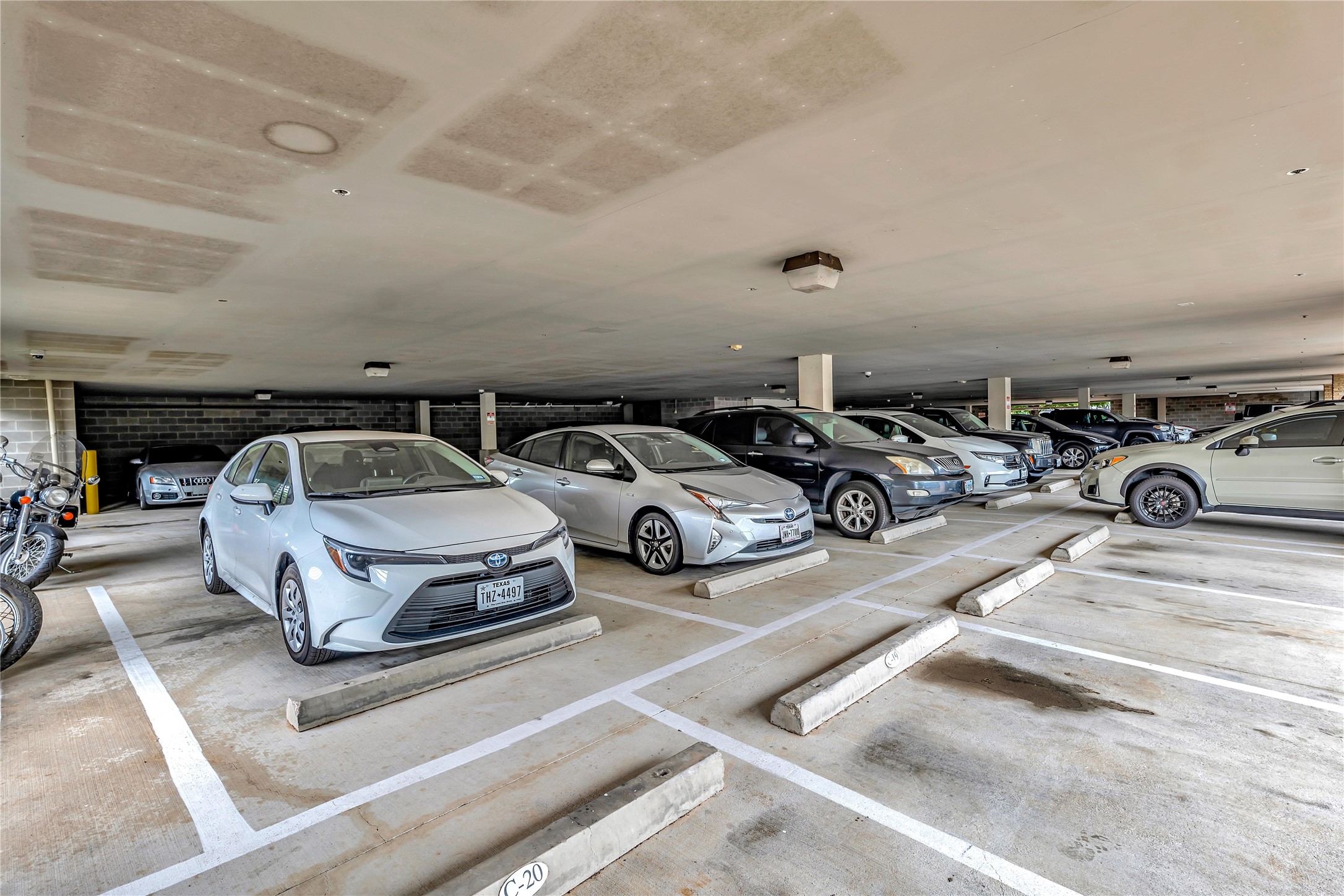 2124 East 6th Street, Unit 305 Austin, TX 78702 - Photo 26 of 35 a car parked in parking