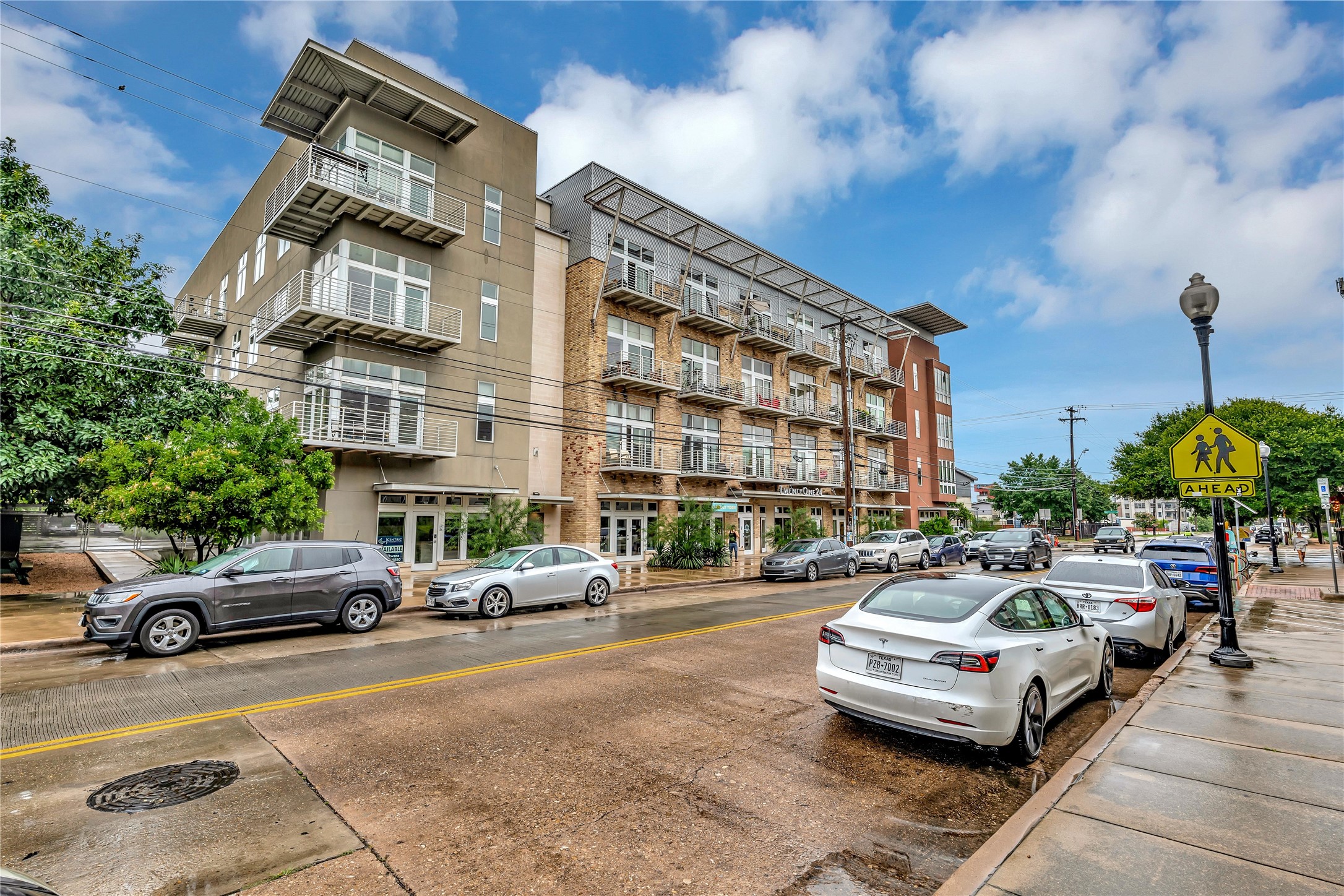 2124 East 6th Street, Unit 305 Austin, TX 78702 - Photo 32 of 35 a car parked in front of a building