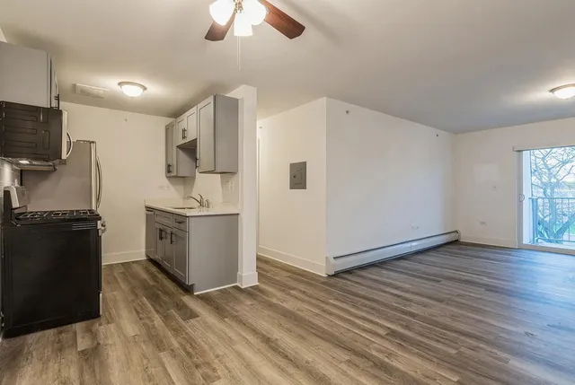 a view of a kitchen with electric appliances