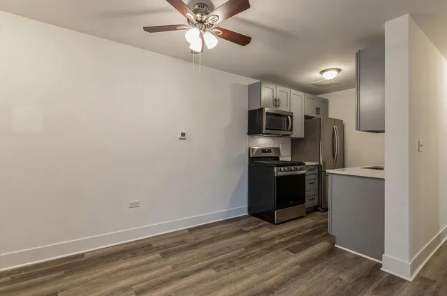 a kitchen with a refrigerator and a microwave