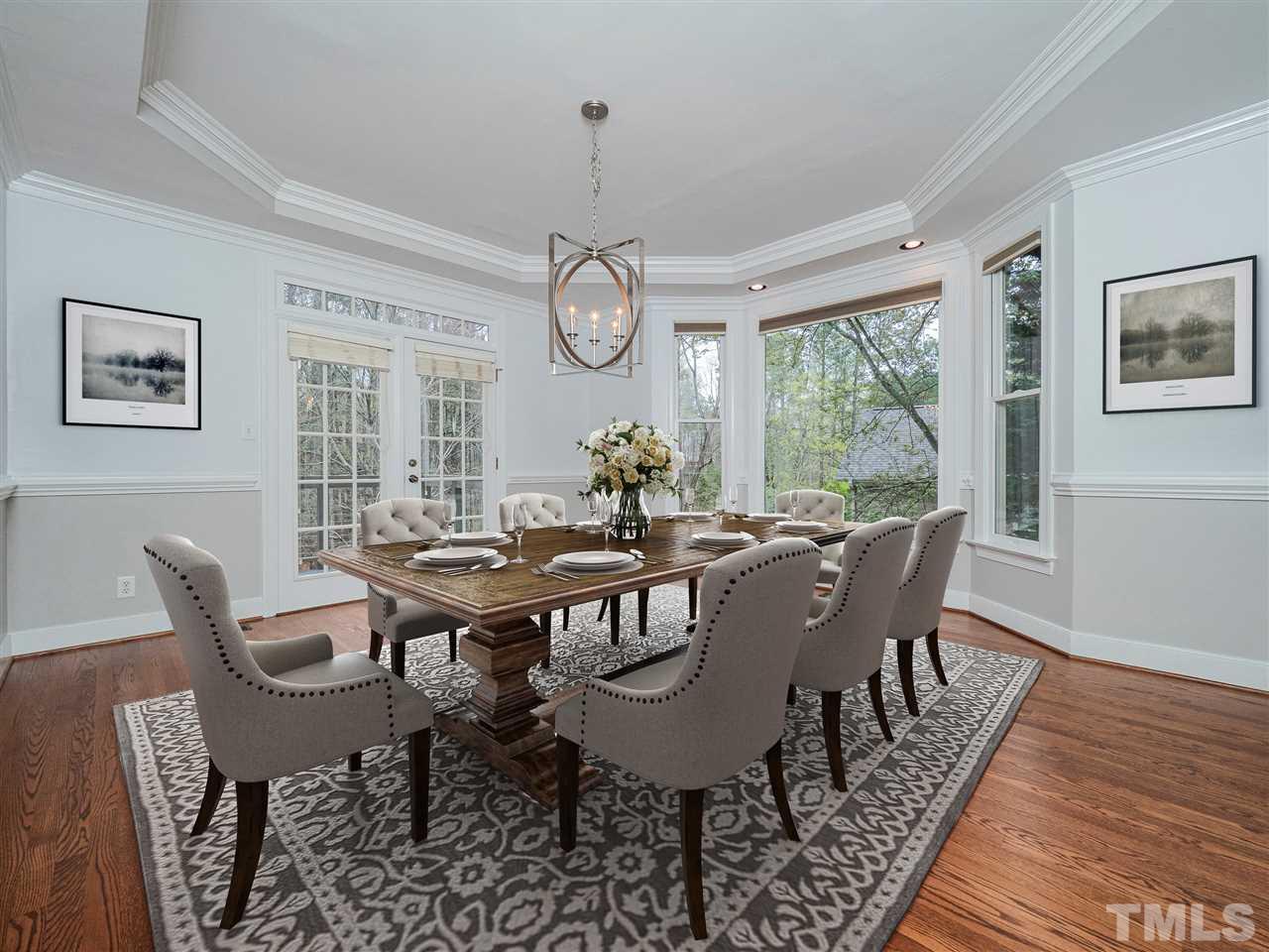 206 Chiselhurst Way Cary, NC 27513 - Photo 11 of 30 a view of a dining room with furniture window and wooden floor