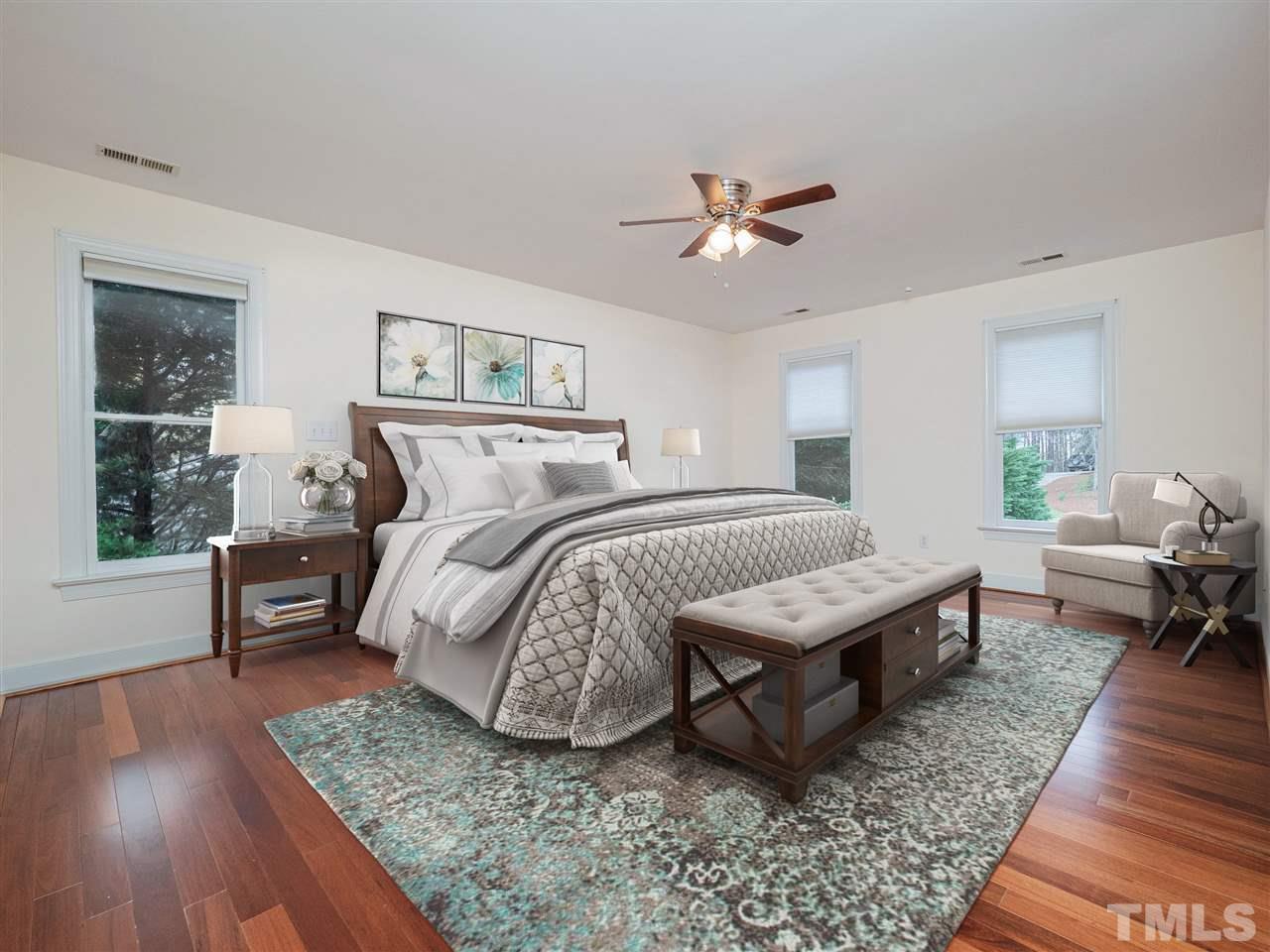 206 Chiselhurst Way Cary, NC 27513 - Photo 18 of 30 a bedroom with furniture and a wooden floor