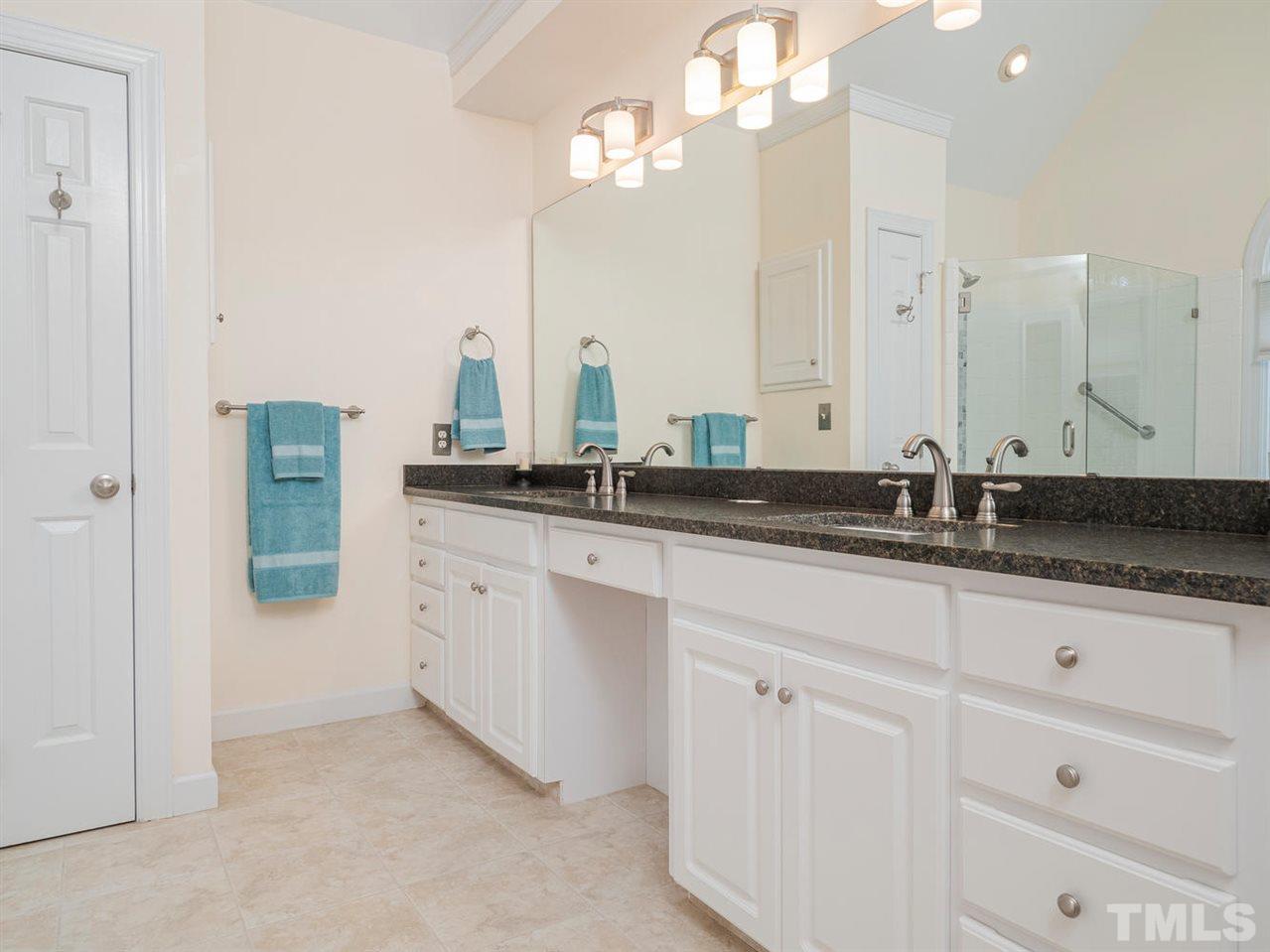 206 Chiselhurst Way Cary, NC 27513 - Photo 21 of 30 a bathroom with a sink and a mirror