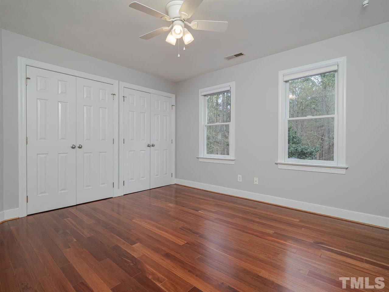 206 Chiselhurst Way Cary, NC 27513 - Photo 26 of 30 a view of empty room with wooden floor and fan