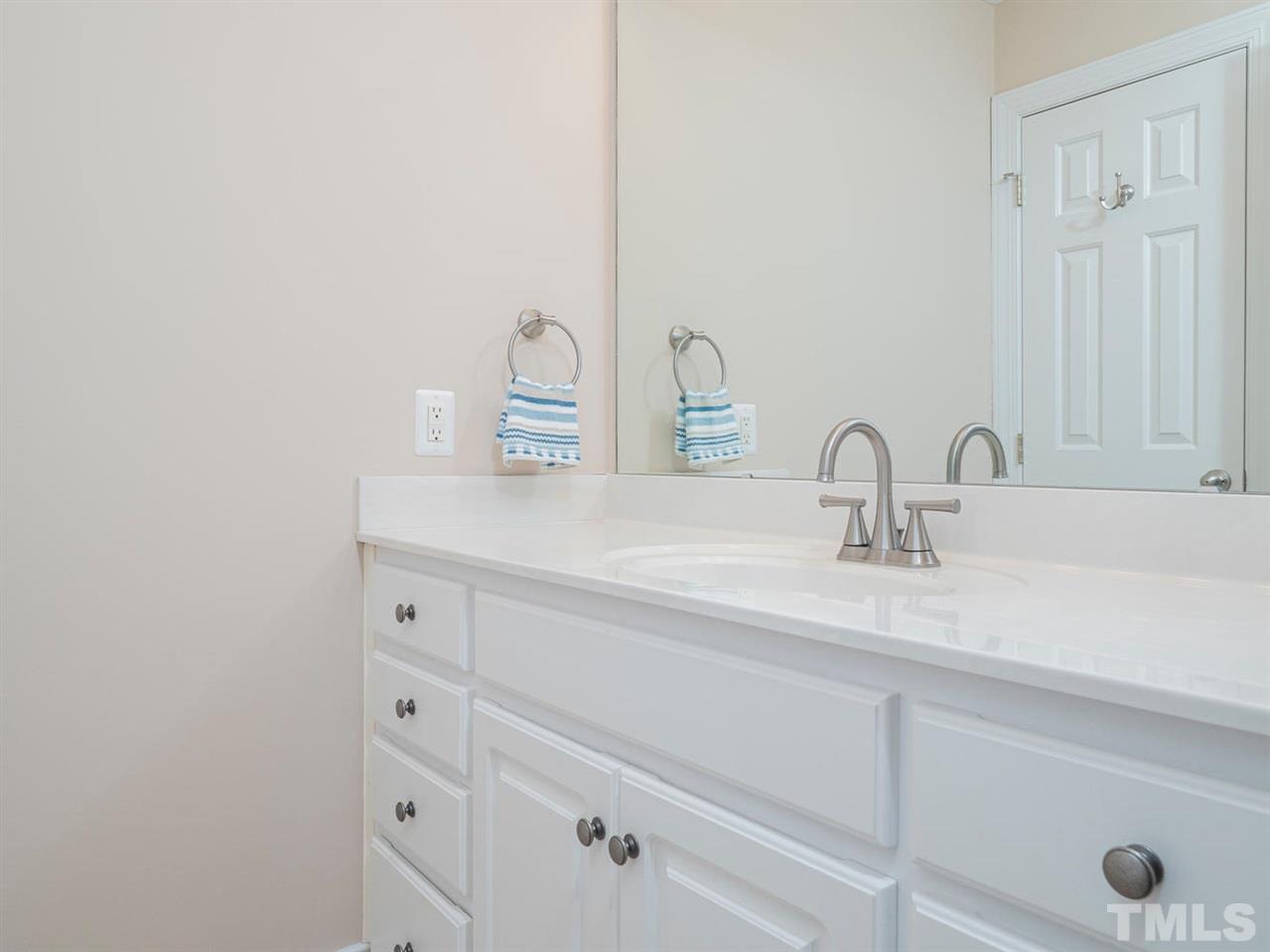 206 Chiselhurst Way Cary, NC 27513 - Photo 27 of 30 a bathroom with a sink and a mirror