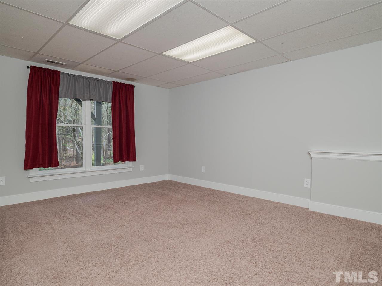 206 Chiselhurst Way Cary, NC 27513 - Photo 29 of 30 an empty room with windows