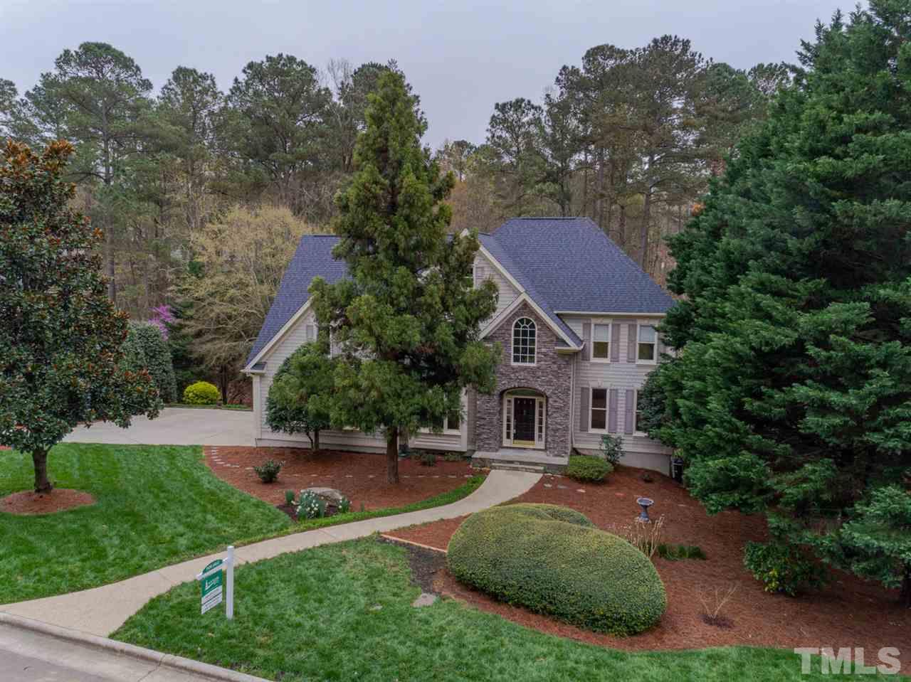206 Chiselhurst Way Cary, NC 27513 - Photo 6 of 30 a view of a white house with a yard plants and large tree