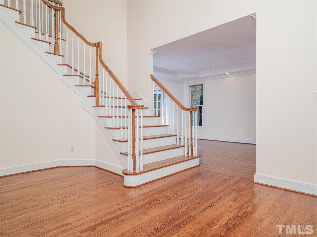 206 Chiselhurst Way Cary, NC 27513 - Photo 7 of 30 a view of entryway and hall with wooden floor