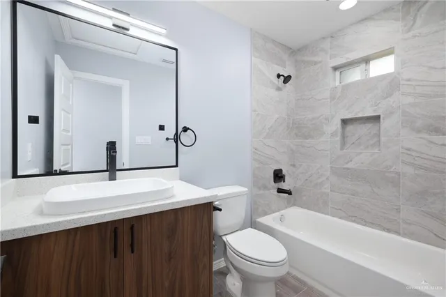 an empty room with a window and ceiling fan