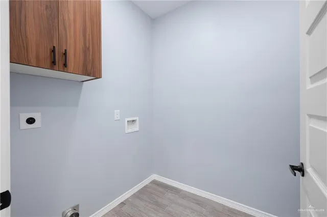 an empty room with window and ceiling fan