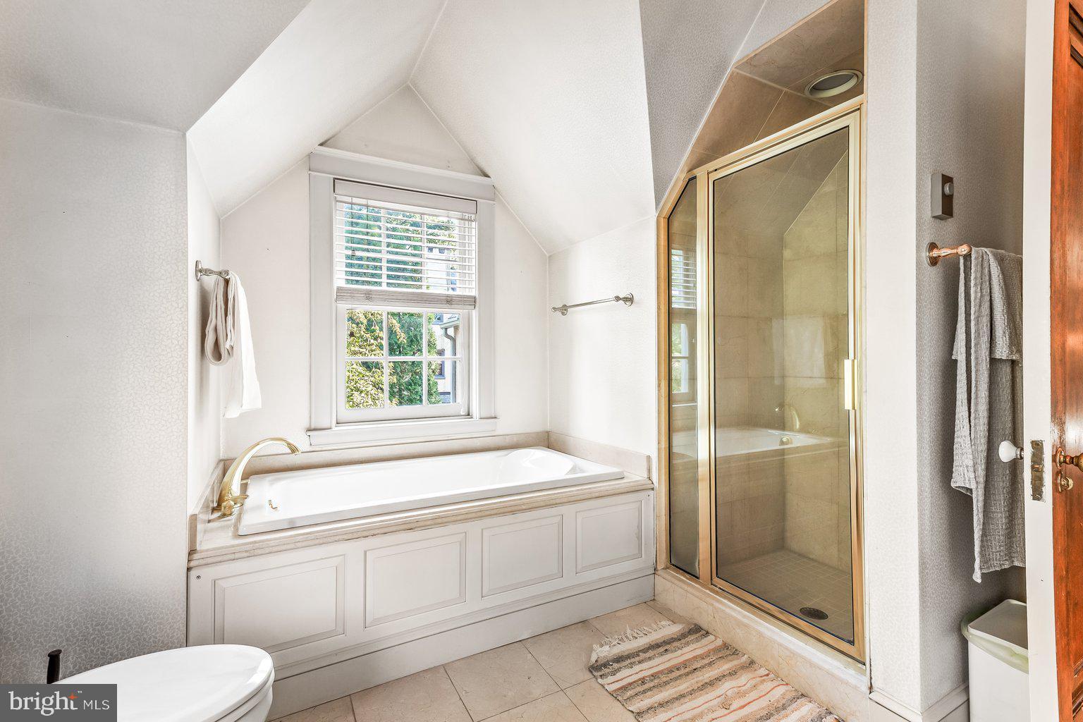 5507 Roland Avenue Baltimore, MD 21210 - Photo 38 of 87 a bathroom with a bathtub and a shower