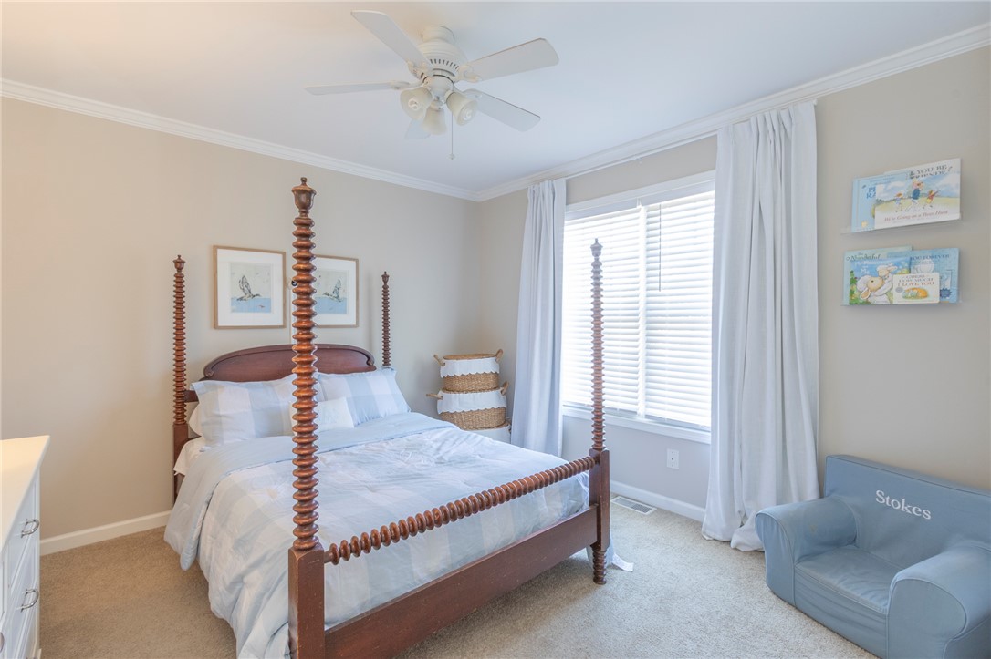 208 Mahaffey Road Williamston, SC 29697 - Photo 19 of 44 This cozy bedroom features warm tones and ample natural light, creating a tranquil retreat.
