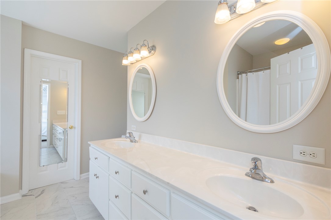 208 Mahaffey Road Williamston, SC 29697 - Photo 28 of 44 This bathroom offers a double vanity with ample counter space and individual mirrors.