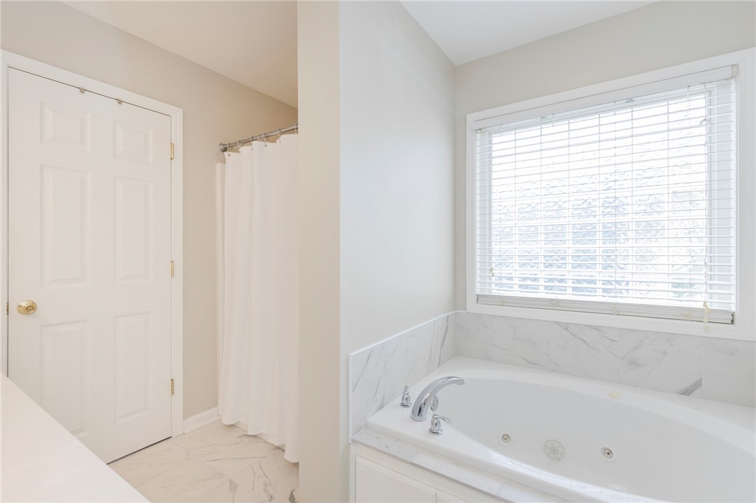 208 Mahaffey Road Williamston, SC 29697 - Photo 30 of 44 Relax in the comfort of this bright bathroom featuring a spacious soaking tub.
