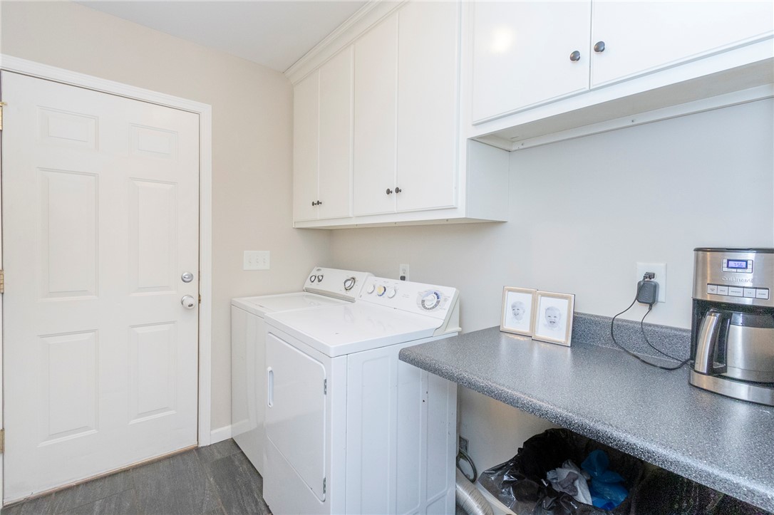 208 Mahaffey Road Williamston, SC 29697 - Photo 32 of 44 This functional laundry area offers practical storage and space for daily chores.