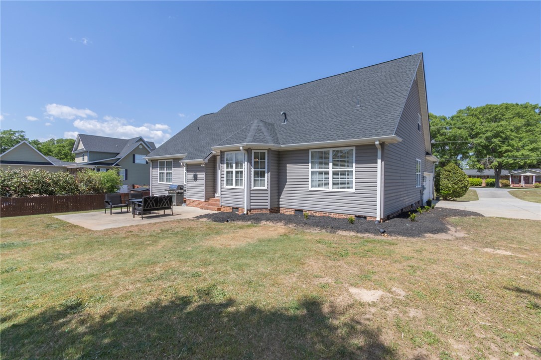 208 Mahaffey Road Williamston, SC 29697 - Photo 38 of 44 This residence features a well-maintained yard and a comfortable patio, perfect for outdoor enjoyment.